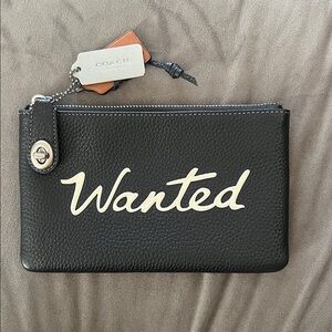 Coach Black and Cream Nomad Pebble Leather Wristlet with Turn Lock Clasp NWOT